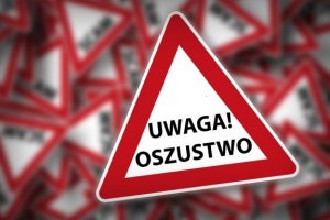 na zdjęciu widać trójkąt ostrzegawczy z napisem uwaga oszustwo