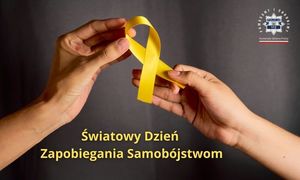 grafika z dwiema dłońmi trzymającymi żółtą wstążkę