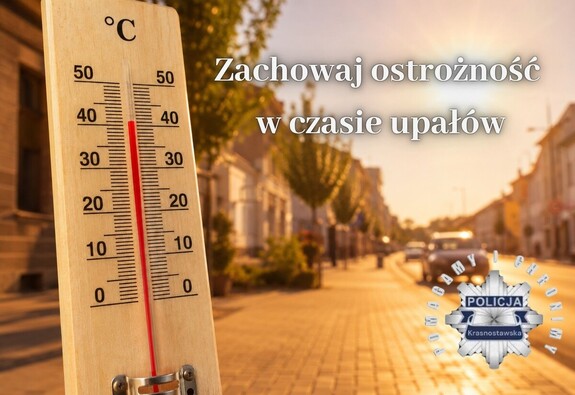 Termometr na tle nasłonecznionej ulicy. Napis "Zachowaj ostrożność w czasie upałów"